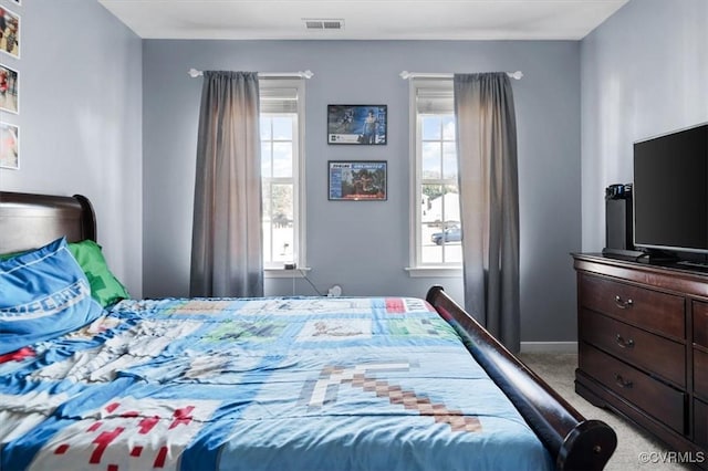 bedroom featuring carpet, visible vents, and baseboards