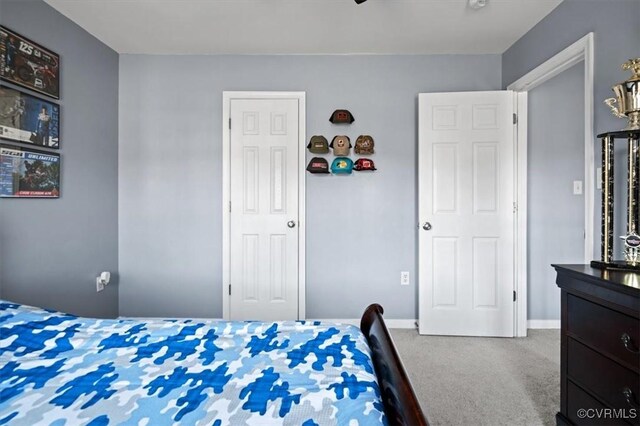 carpeted bedroom with baseboards