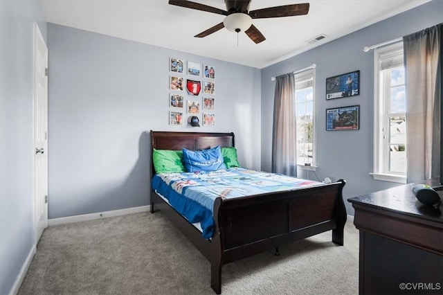 bedroom featuring baseboards, ceiling fan, visible vents, and light colored carpet