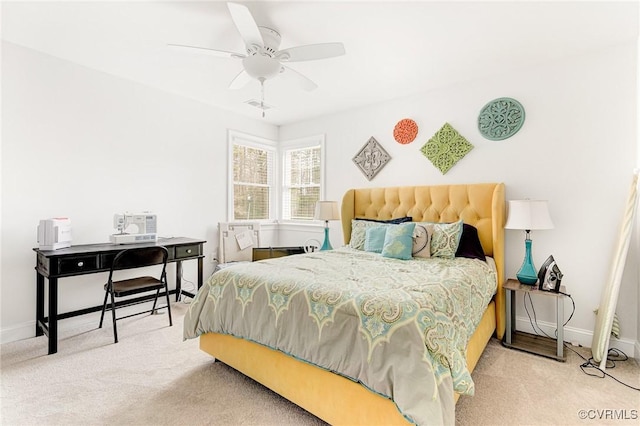 bedroom featuring carpet, visible vents, baseboards, and ceiling fan