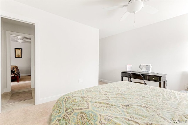 bedroom with a ceiling fan, carpet, and baseboards