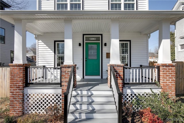 property entrance featuring covered porch