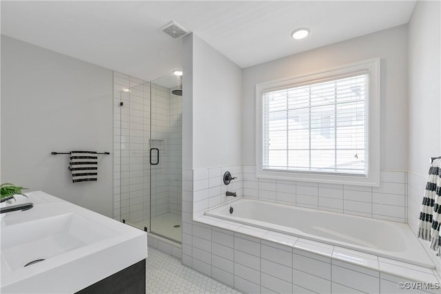 full bath featuring a stall shower, visible vents, a bath, and tile patterned floors