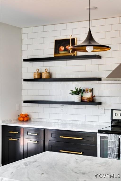 bar with tasteful backsplash and stainless steel electric range