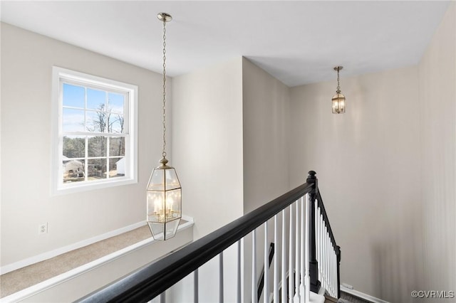 hallway featuring an upstairs landing