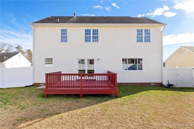 back of property with crawl space, a fenced backyard, a lawn, and a deck