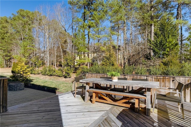 wooden deck featuring outdoor dining space