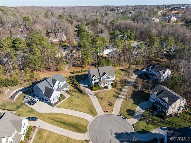 birds eye view of property with a wooded view