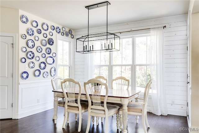 dining room featuring a chandelier and dark wood-style flooring