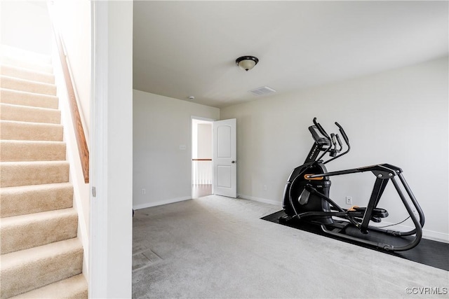 workout room with visible vents, baseboards, and carpet flooring