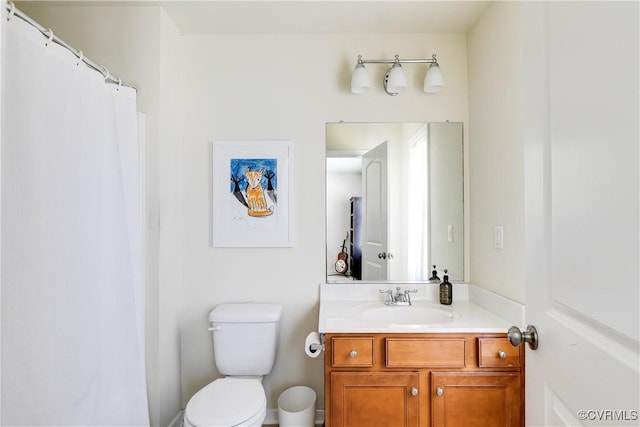 full bathroom featuring toilet and vanity