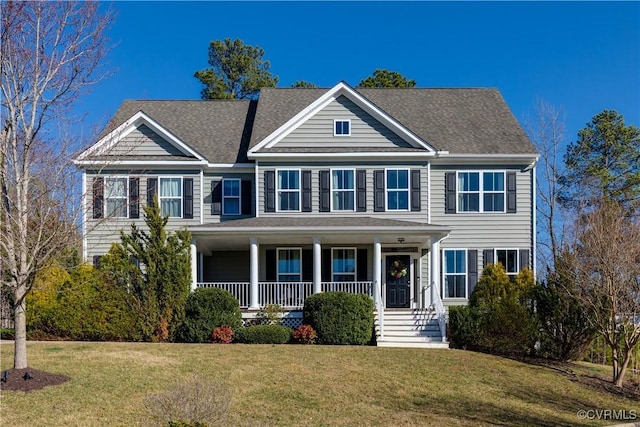 view of front of home featuring covered porch and a front lawn