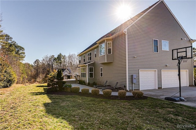 view of property exterior with a garage, concrete driveway, and a lawn