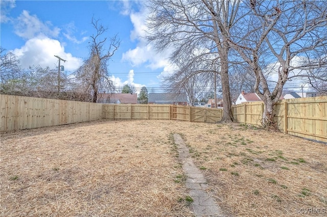 view of yard featuring a fenced backyard