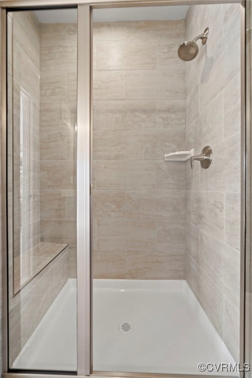 bathroom with a shower stall