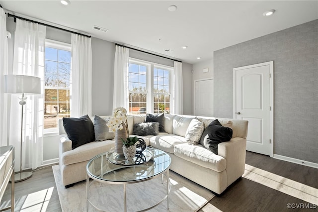 living room featuring baseboards, recessed lighting, wood finished floors, and wallpapered walls