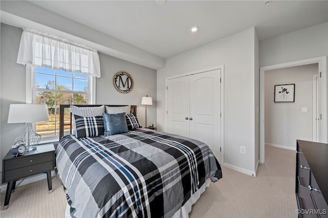 bedroom with carpet floors, recessed lighting, a closet, and baseboards