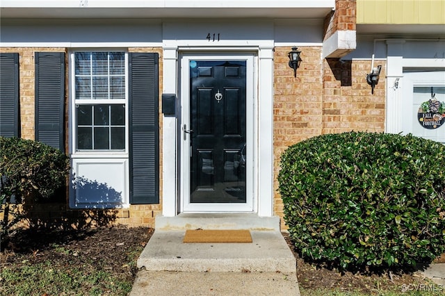 doorway to property featuring stone siding