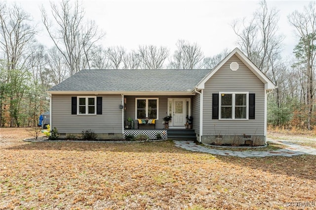 ranch-style home featuring crawl space, a porch, and a shingled roof