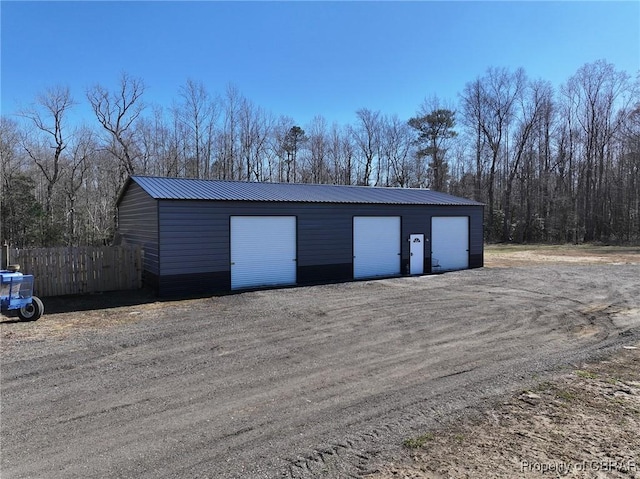 detached garage with fence