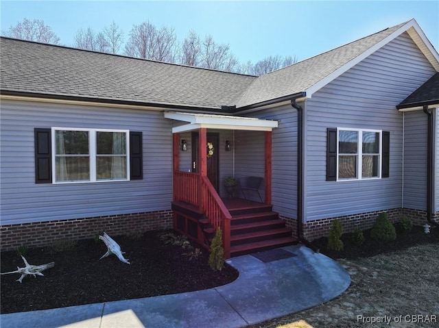 view of front of home with a shingled roof