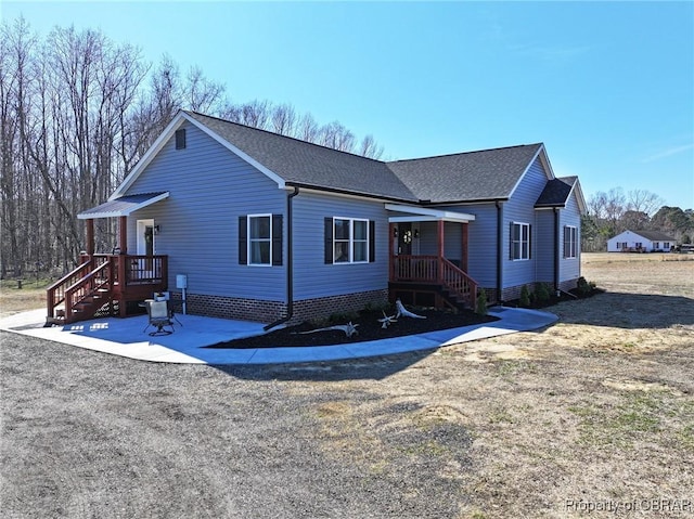 view of front of property with roof with shingles