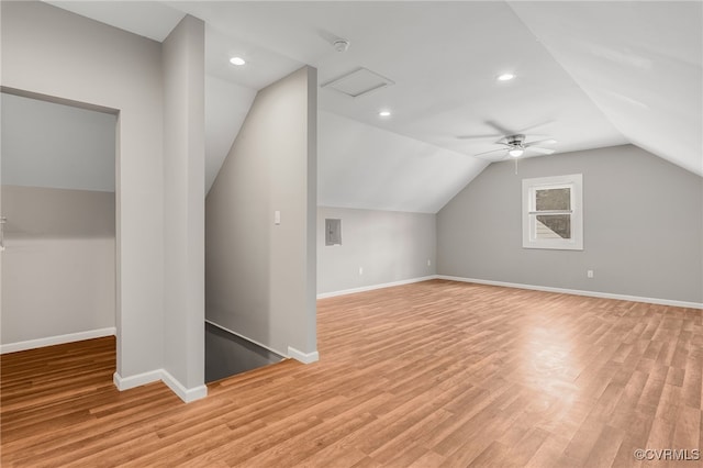 bonus room with recessed lighting, light wood-style floors, attic access, vaulted ceiling, and baseboards