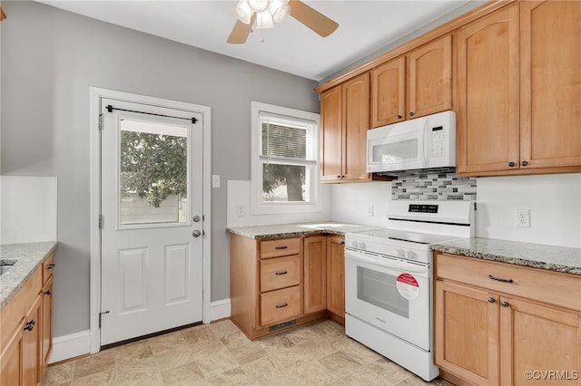 kitchen with light stone counters, white appliances, decorative backsplash, and a ceiling fan