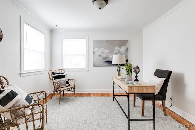 office area with ornamental molding, wood finished floors, and baseboards