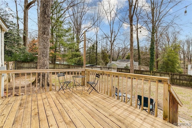 deck with a fenced backyard