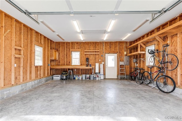 garage featuring wood walls