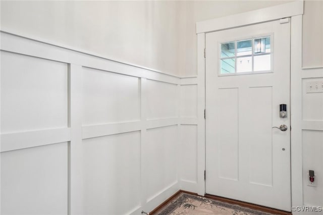 entrance foyer featuring a decorative wall