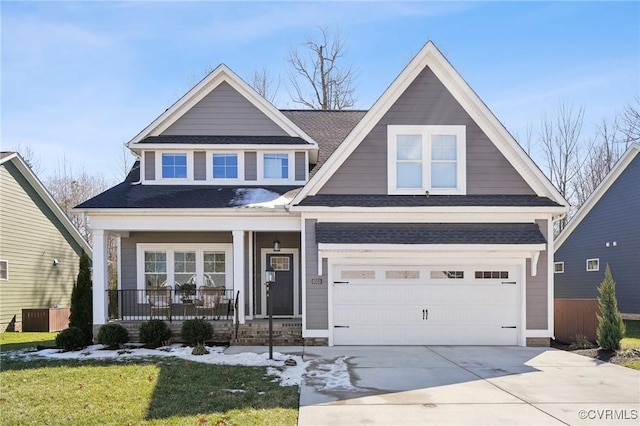 view of front of property with a garage, concrete driveway, and a porch