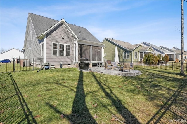 rear view of property featuring a lawn, a sunroom, crawl space, fence, and a patio area