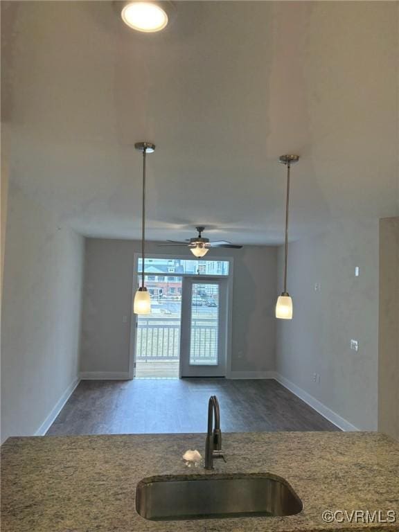 10530 Stony Bluff Dr Unit 304, Ashland, VA 23005 - kitchen featuring a sink, stone countertops, pendant lighting, and ceiling fan