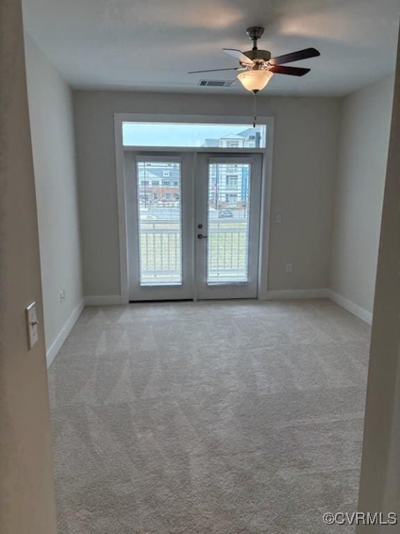 10530 Stony Bluff Dr Unit 304, Ashland, VA 23005 - empty room featuring visible vents, light carpet, a ceiling fan, french doors, and baseboards