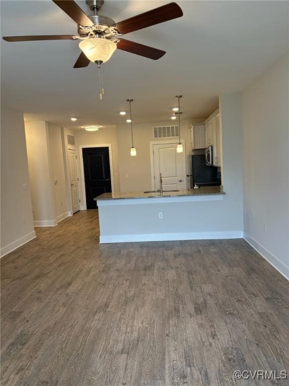 10530 Stony Bluff Dr Unit 304, Ashland, VA 23005 - kitchen featuring visible vents, a sink, refrigerator, dark wood-style floors, and white cabinetry