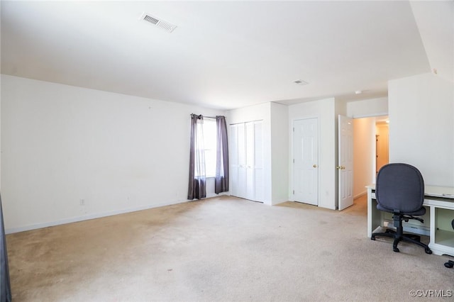 office with light colored carpet, visible vents, and baseboards