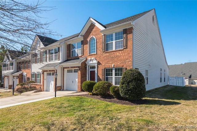 view of front of property featuring driveway, brick siding, an attached garage, and a front yard