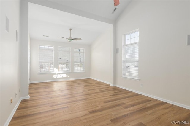 empty room featuring light wood-type flooring, visible vents, baseboards, and a ceiling fan