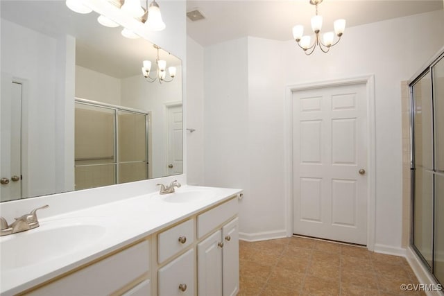 full bathroom with a chandelier, a sink, and a shower with shower door