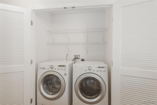 laundry area with washer and dryer and laundry area