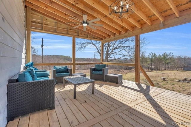 wooden deck featuring ceiling fan and an outdoor living space