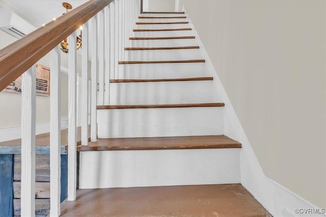 staircase featuring concrete floors