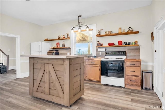 kitchen with open shelves, light countertops, hanging light fixtures, light wood-type flooring, and white appliances