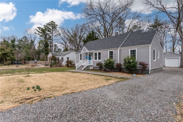 single story home featuring a garage, a shingled roof, an outdoor structure, driveway, and a front lawn