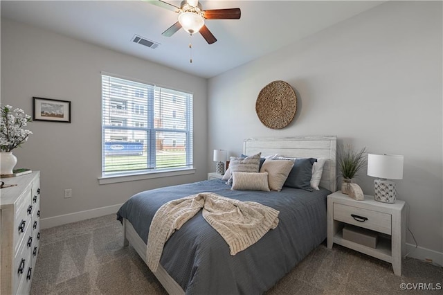 carpeted bedroom with ceiling fan, visible vents, and baseboards