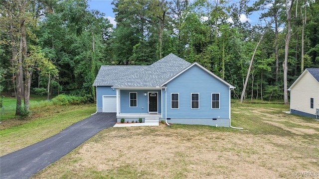 view of front of home featuring driveway, a shingled roof, crawl space, covered porch, and a front yard