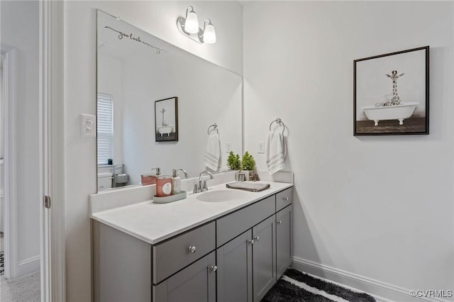 bathroom featuring vanity and baseboards