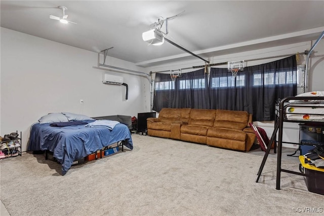 bedroom featuring a garage, a wall mounted air conditioner, and carpet flooring